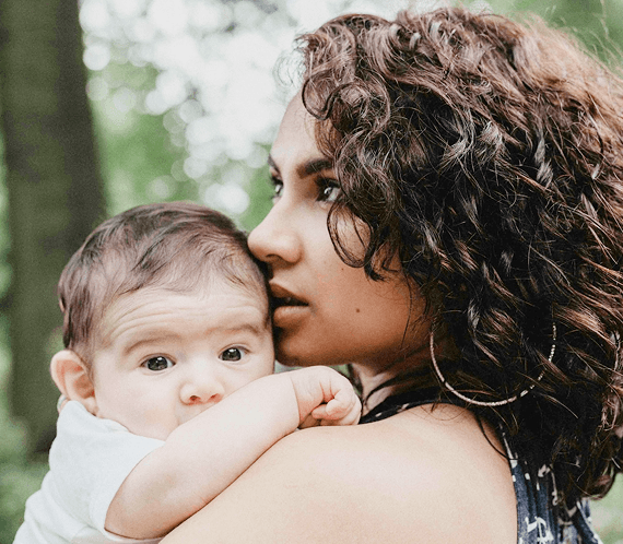 An image of a mother hugging her baby