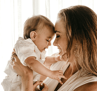 An image of a mother carrying baby